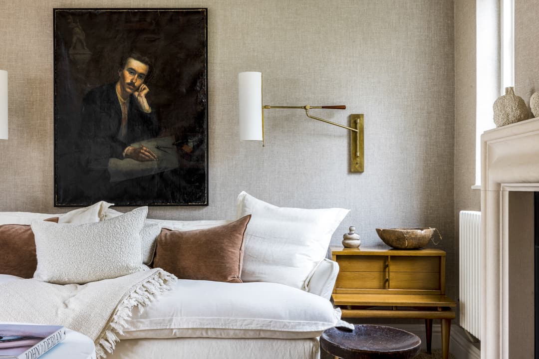 white couch and a painting